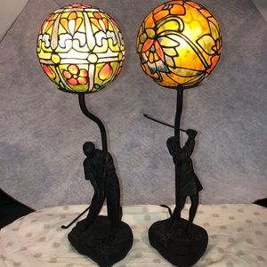 Lady and Man golfers in resin with bronze look lamps.
